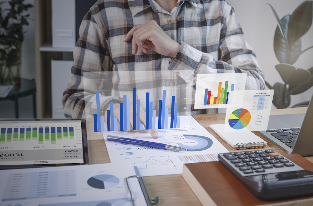 Businesspeople Working In Finance And Accounting Analyze Financial Graph Budget And Planning For Future In Office Room.
